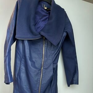IMAN faux leather blue jacket w/fabric coming down sleeve. . Size medium.